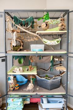 a bird cage filled with lots of toys