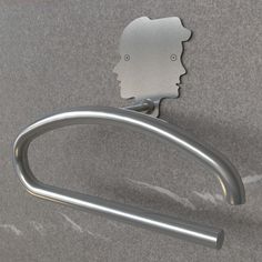 a metal hook with a face on it