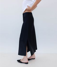 We continue to perfect our slip skirt. Once you slip on this insanely luxe silky charmeuse skirt, you'll realize that it's the sexiest companion you've ever seen to every tank top, knit top, sweater, blouse and button down you own (truly–this pairs with everything, it's like magic). It works with heels, sandals, loafers and even sneakers. It's possible that you may go through a phase where you wear nothing else. HERE FOR IT. Spring Date Night Satin Skirt, Spring Satin Skirt For Night Out, Silk Asymmetrical Skirt For Night Out, Silk Long Skirt For Fall, Relaxed Satin Skirt For Fall, Summer Satin Skirt For Date Night, Summer Date Night Satin Skirt, Silk Midi Skirt Bottoms For Fall, Silk Lined Skirt For Fall