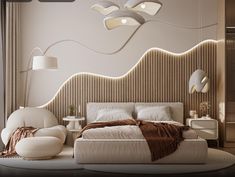 a bedroom with a bed, chair and lamps on the wall above it is decorated in beige tones