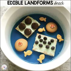 a bowl filled with cookies and desserts on top of a table