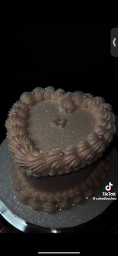 a cake with frosting in the shape of a heart