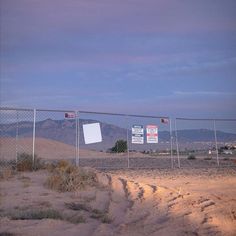 there is a sign on the fence that says don't enter this area,