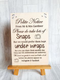 a wooden sign with words on it that say, polite nature from mr and mrs gardier please do take lots of snaps but we would prefer them kept under wraps