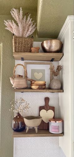 some shelves with vases and other items on them