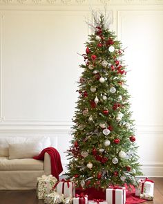 a decorated christmas tree with presents under it