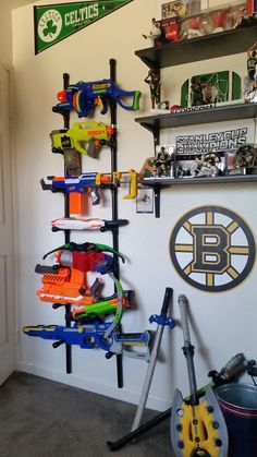 a room filled with lots of toys and clutter on top of the shelves next to a wall