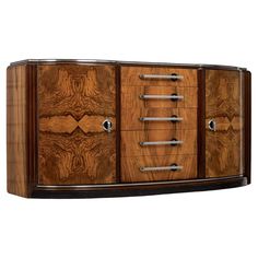 an art deco sideboard with metal handles and wood veneers on the doors