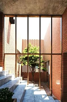 an open door leading into a courtyard with stairs