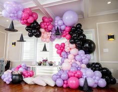 a room filled with lots of balloons and decorations