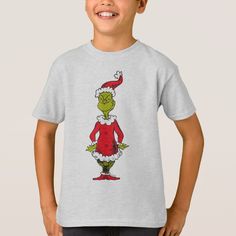 a young boy wearing a t - shirt with an image of the grin on it