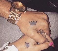 two people with matching tattoos on their hands