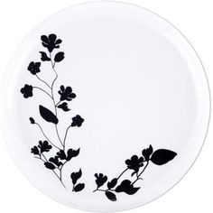 a white plate with black flowers on it