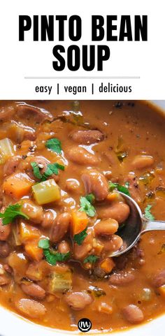 a white bowl filled with bean and vegetable soup