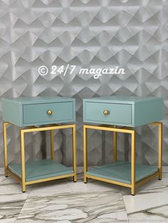 two blue and gold nightstands against a wall with geometric tiles on the walls behind them