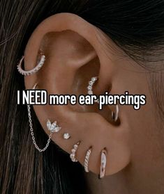 an ear piercing with the words i need more ear piercings