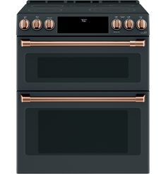 two ovens side by side, one black and the other rose gold