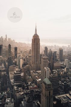 an aerial view of a city with tall buildings and skyscrapers in the foreground