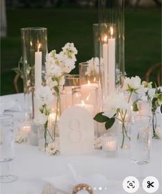 the table is set with candles and flowers