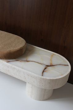 a white and brown object sitting on top of a table