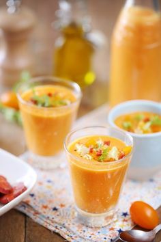 three small cups filled with food on top of a table