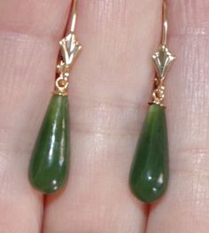 Vintage gorgeous genuine 14k green jade jadeite tear drop lever back earring vintage adorable pair of 14k gold hand carved 33 mm jade lever back earrings length of drops 33 mm diameter of jade 6mm at widest part noticeable size stylish / 2.4 grams / 12 carats vintage old stock jades every pair is a bit different based on the nature of jade. gorgeous coloring on these carved green jades very cool looking. you will love wearing it. Jade Earrings, Gold Hand, Leverback Earrings, Jewelry Lookbook, Jade Jewelry, Green Earrings, Fantasy Jewelry, Green Jade, Jewelry Inspo