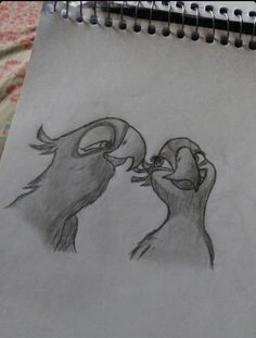 a drawing of two birds kissing each other