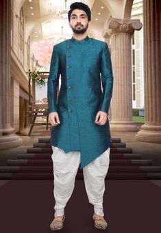 A Long and royal indian ethnic indian wear sherwani especially designed for men in order to make an occasion very especial. It is elegantly made with hands to bring about a feel about India. Look your best on your special day while you carry your sharp attitude with this indowestern sherwani paired with a churidar. Colored in oxford blue color and black embellished with woven work. Available with gold color cotton silk churidar. Slip on to some matching mojari and a matching safa to complete the Green Long Sleeve Designer Sherwani, Fitted Green Bandhgala With Naqshi, Fitted Green Bandhgala With Naqshi Detailing, Green Fitted Kurta With Naqshi, Designer Green Fitted Sherwani, Green Dabka Detailed Long Sleeve Sherwani, Green Long Sleeve Sherwani With Dabka, Green Long Sleeve Dabka Sherwani, Ceremonial Green Kurta With Naqshi