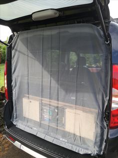 the back end of a van with its cargo compartment open