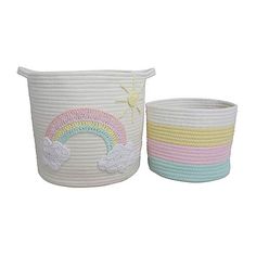 two white baskets with rainbows and clouds painted on the sides, one has a sun