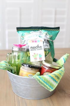 a bucket filled with food sitting on top of a wooden table