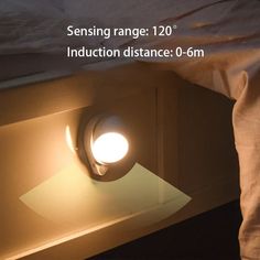 a close up of a light on a bed