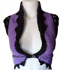 a mannequin wearing a purple and black crocheted scarf