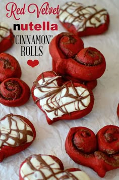 red velvet muffela cinnamon rolls with white chocolate drizzled on top