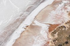 an aerial view of the ocean and land