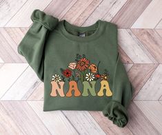 Wildflowers Nana Crewneck Sweatshirt, Nana Sweatshirt, Mothers Day Gift For Grandma, Nana Gifts, Nana Shirt, Nana Sweater Nana Birthday Gift  SIZING  ❥ This sweatshirt has a modern unisex fit. Runs true to size. ❥ Please refer to size chart before ordering. Measure your favorite sweatshirt armpit to armpit and top to bottom and compare it with the size chart provided to ensure an accurate fit.  DELIVERY TIMES  ❥ We take about 1-5 business days to create the items. ❥ Everything is printed and han Skin Therapist, Pediatric Care, Play Therapy, Nurse Sweatshirt, Mama Shirts, Mama Sweatshirt, Grad Gifts, Child Life, Nursing Shirts