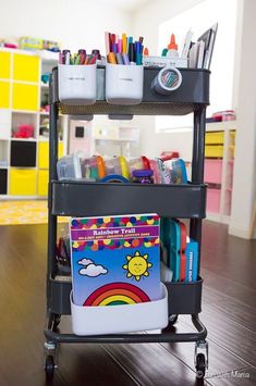 a cart filled with lots of school supplies on top of a hard wood floor