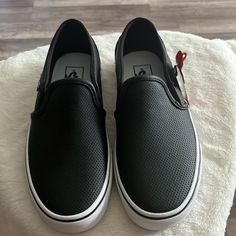 Iconic Slip-On Shoe Low Profile Perforated Leather Uppers Supportive Padded Collars Elastic Side Accents Signature Rubber Waffle Outsoles Emo Shoes, Black Slip On Shoes, Shoes Vans, Black Slip On, Vans Slip On, Vans Black, Perforated Leather, Womens Vans, Vans Shoes