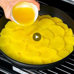 someone is cooking something in a pan on the stove with oil and pineapple slices