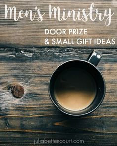 a cup of coffee sitting on top of a wooden table with the words must have coffee