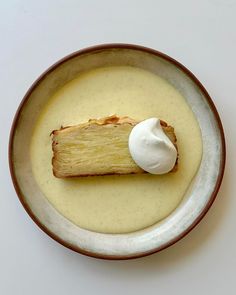 a plate that has some kind of food on it with cream in the middle,