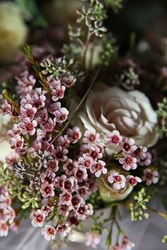 a bouquet of flowers sitting on top of a table