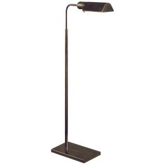 a lamp that is on top of a metal stand with a black base and a white background