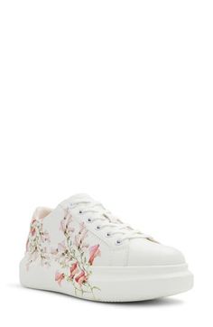 Dreamy watercolor flowers bloom across the midsole and sidewall of this romantic low-top platform sneaker cushioned by dual-density foam for all-day comfort. Cushioned footbed with arch support Pillow Walk™ comfort technology Synthetic upper/recycled-polyester textile lining/rubber and leather sole Imported Flatform Sneakers, Floral Sneakers, How To Make Handbags, Platform Sneaker, Aldo Shoes, Sneaker Brands, Sneaker Collection, Platform Sneakers, Sporty Style