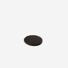 a round black object on a white background