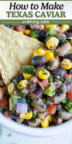 a white bowl filled with black eyed peas, corn and tortilla chips on top