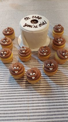 cupcakes are arranged in the shape of smiley faces