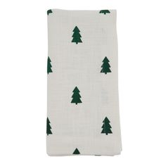 a tea towel with green trees on it