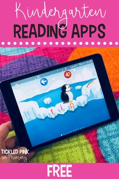 a hand holding an ipad with the text kindergartn reading apps on it