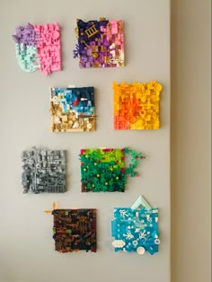 there are many legos on the wall and one is made out of plastic blocks